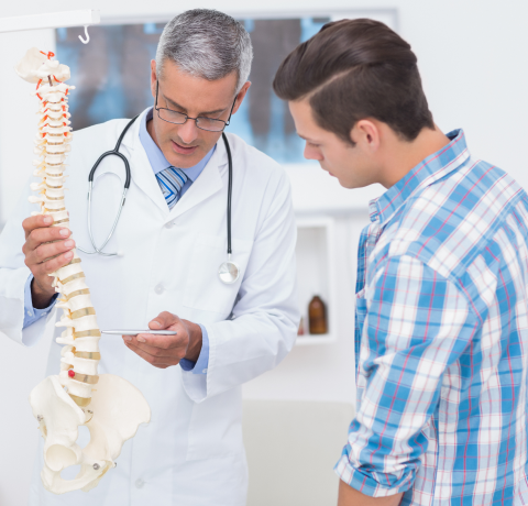 Medical staff explaining something with an example column.