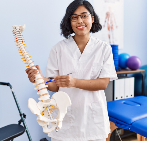 female doctor with an example spine